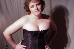 Cassi-black-corset-garters-and-thong-cleavage-13